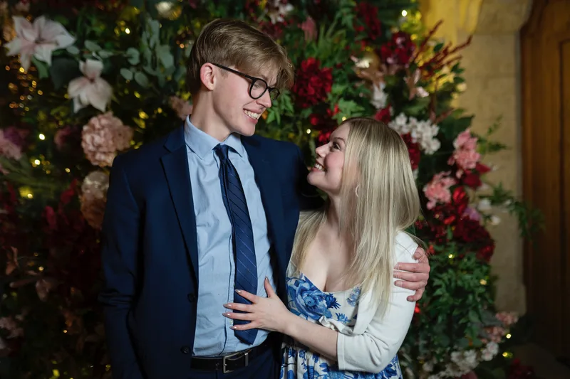Matthew and Kelsey laughing together in formalwear